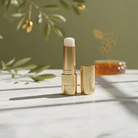 Natural | The olive branches and marble surface create a natural and organic setting.